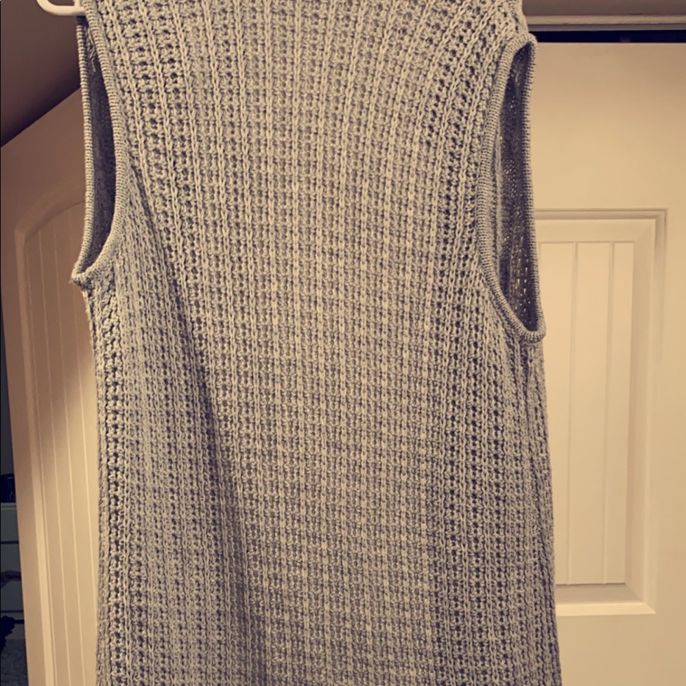 Long sweater vest. Passes your knees